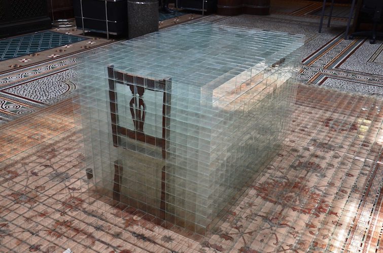 image: David Cheeseman 'Once ever After: Twice Removed' 383×290×81(h)cm, 2014, glass, tape, carpet and furniture (7,752 glass boxes, each 58mm cubed) installed at Birmingham City University, Margaret Street in 2014