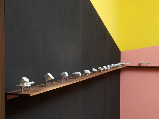 The Rural College of Art 'Found & Forged' (detail) cast aluminium, 14.5(l) × 5.5(h) × 4.5(w)cm, each unique, 2016, from a series of 30 approx. displayed on an american black walnut shelf, installation photo by Andy Keate
