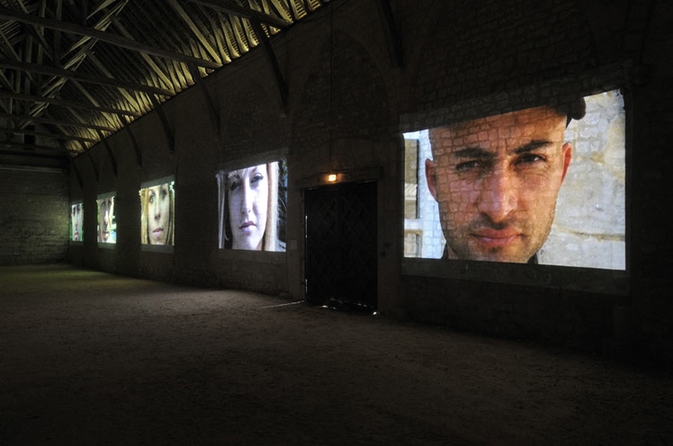 Marcel Dinahet at L'Abbaye de Maubuisson, installation view of video portraits in 'La Grange', 2010–2011.