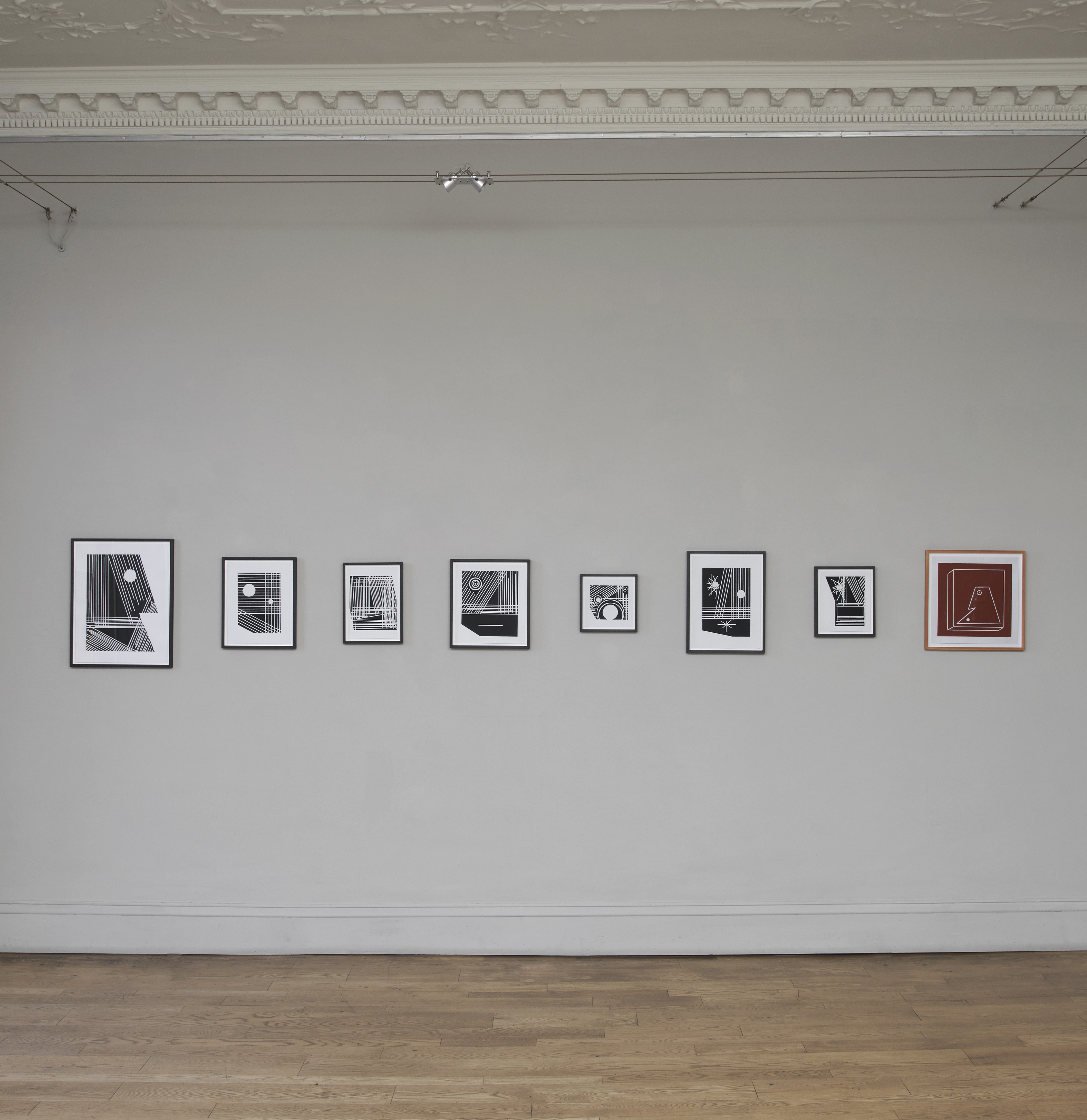 Neil Zakiewicz 'Blinkys' eight from a series of twenty two lino cut prints, made using a circular saw and power drill, installation photography by Andy Keate