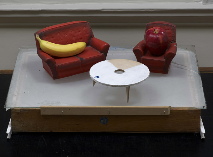 Walter Swennen 'MMX (apple & banana)' (75×60×30cm approx/30×24×12in) found drawer, glass sheet, model plastic 2–piece suite, 1 apple, 1 banana, 2010; photo by Andy Keate.